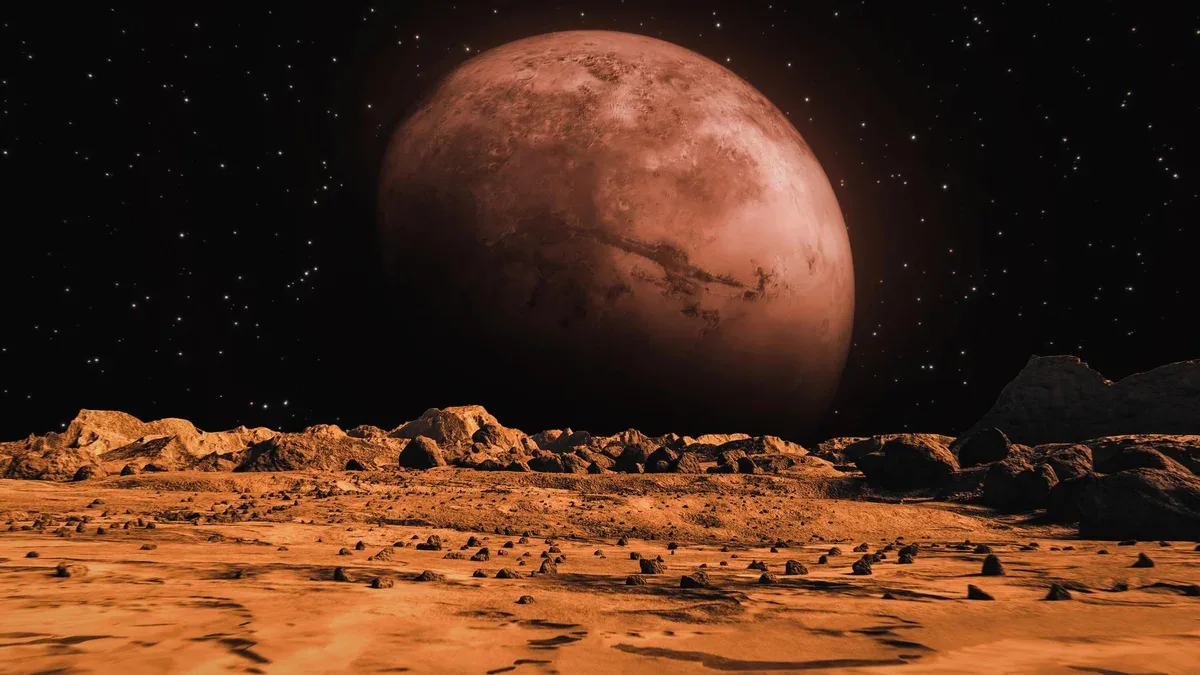 La surface de Mars et une grande planète en arrière-plan